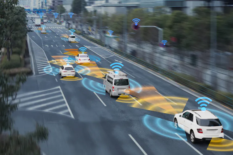 Cars driving on busy road with symbols representing their connection to the internet
