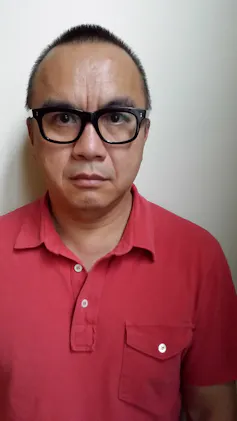 A man in glasses.
