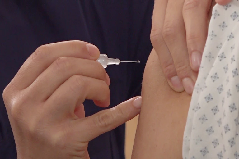 Person receiving a COVID vaccine in Mexico.