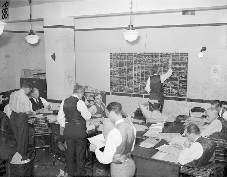 An office filled with employees of the Associated Press tabulating election returns in 1940.