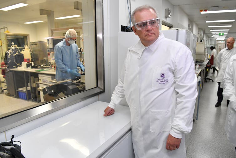 Scott Morrison in a white lab coat