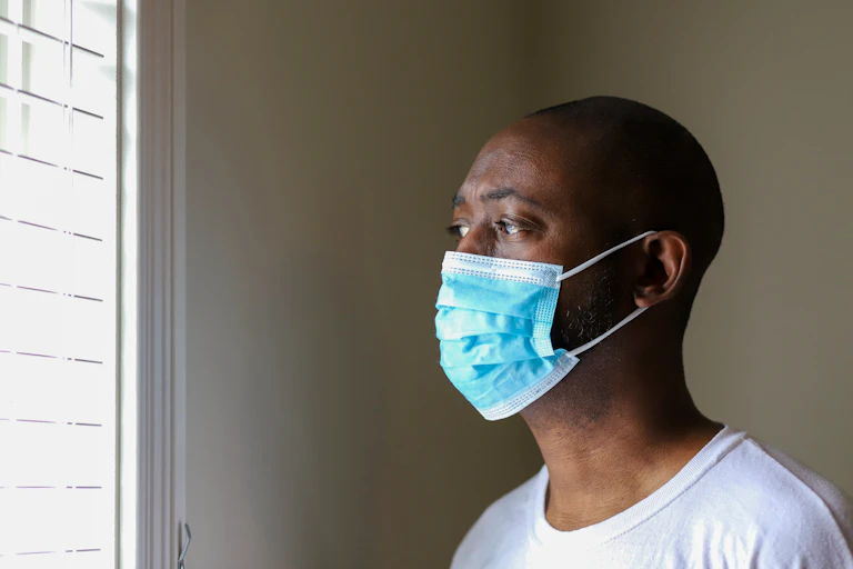 A Black man wearing a face mask.