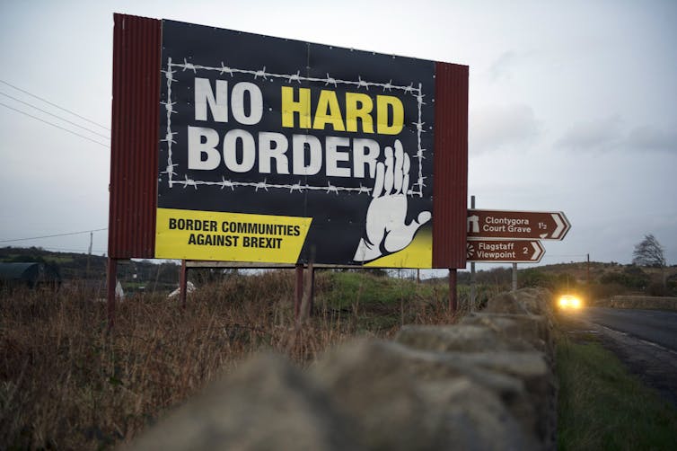 A poster reading 'No hard border' on a road in Northern Ireland.