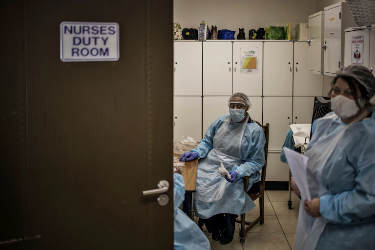 Nurses wearing personal protective equipment