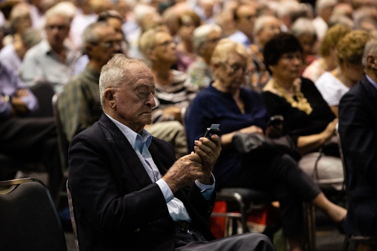 Shareholders vote at a company AGM