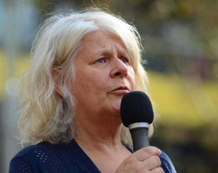 Portrait of Penny Whetton addressing a meeting