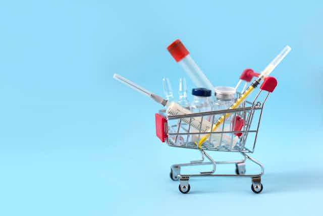 Illustration of vaccines, vials in mini-shopping trolley