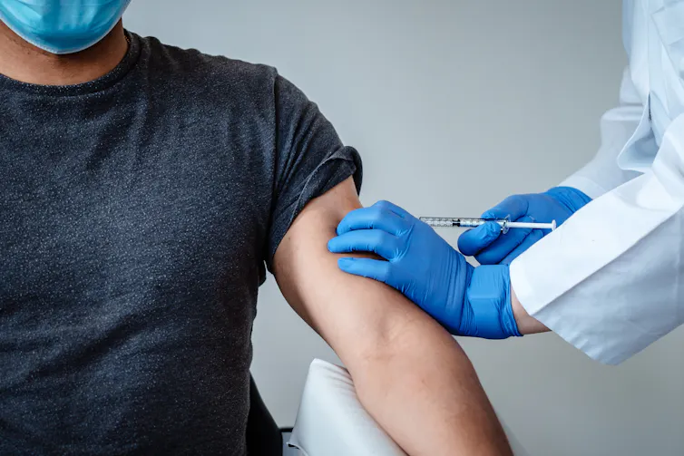 A trial participant being injected with the Pfizer/BioNTech vaccine