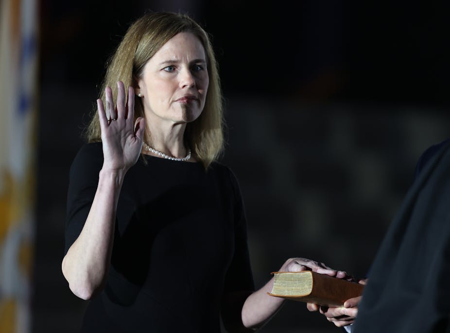 U.S. Supreme Court Associate Justice Amy Coney Barrett is sworn in by Supreme Court Associate Justice Clarence Thomas during a ceremonial swearing-in event on the South Lawn of the White House October 26, 2020.