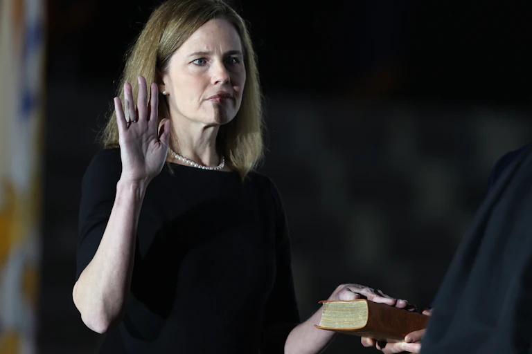 U.S. Supreme Court Associate Justice Amy Coney Barrett is sworn in by Supreme Court Associate Justice Clarence Thomas during a ceremonial swearing-in event on the South Lawn of the White House October 26, 2020.