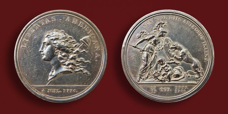 Silver coin depicting liberty as a woman.