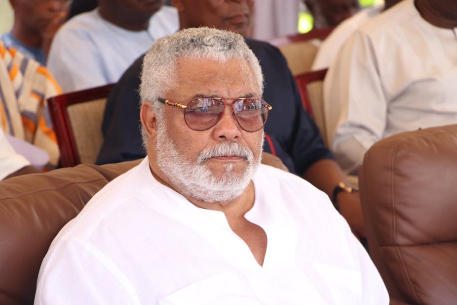 Jerry Rawlings sitting at a public function 