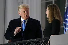 Donald Trump talks to Amy Coney Barrett.