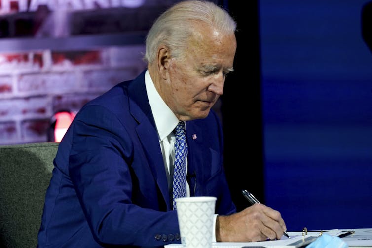 Biden taking notes