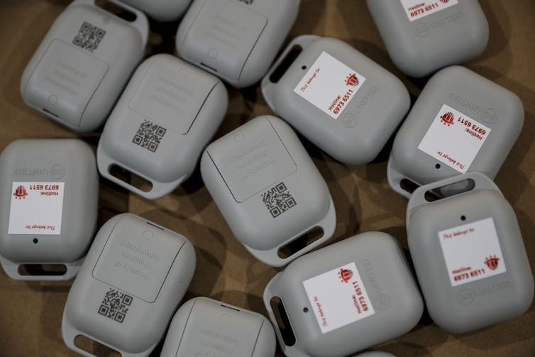 A number of Singapore's track and trace tokens, on a table