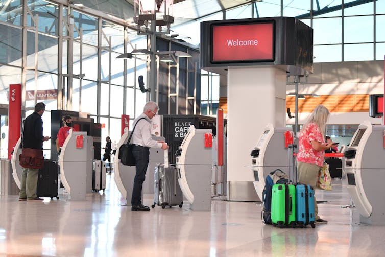 People checking in at the airport.