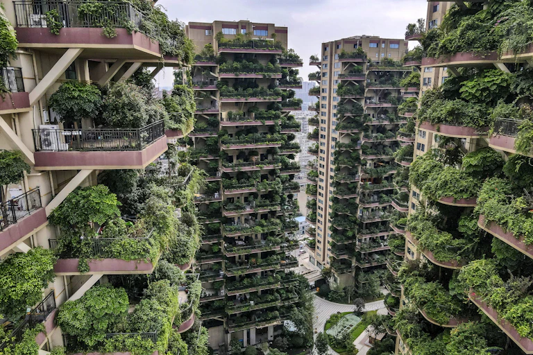 Overgrown vegetation on the balconies of apartments at the Qiyi City Forest Garden residential buildings complex in Chengdu, China.