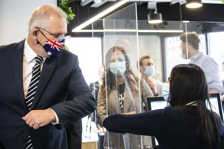 Scott Morrison, wearing a mask, 'shakes elbows'