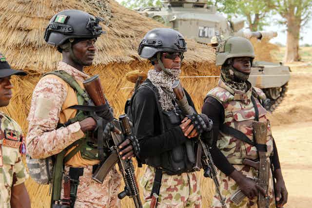 Nigerian Army soldiers stand at a base in Baga, Borno State on August 2, 2019