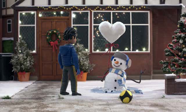 Stop animation of a boy and a snowman with a heart shaped balloon. 