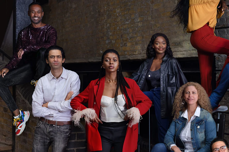 Refugee entrepreneurs pose in a group photograph