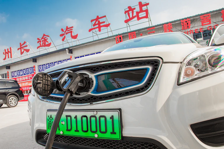 An electric car is charged in Chongqing, China, July 2018