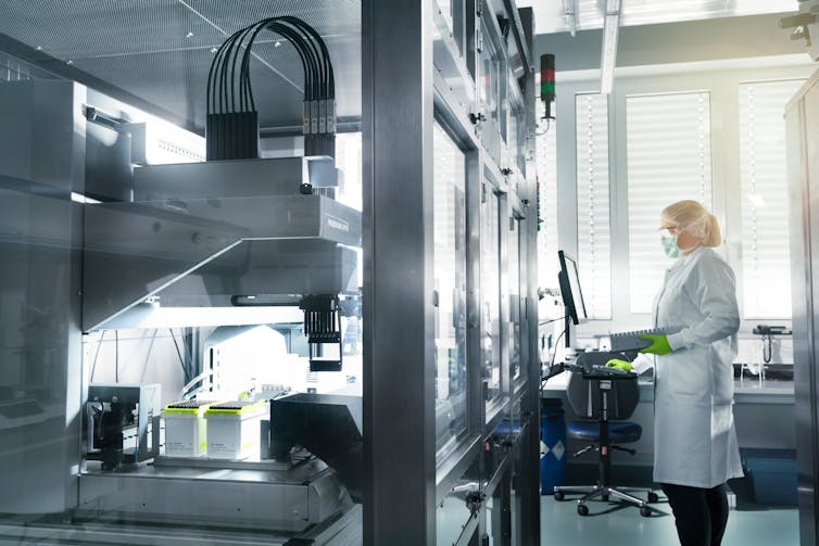 A technician working on the Pfizer/BioNTech vaccine at a BioNTech facility