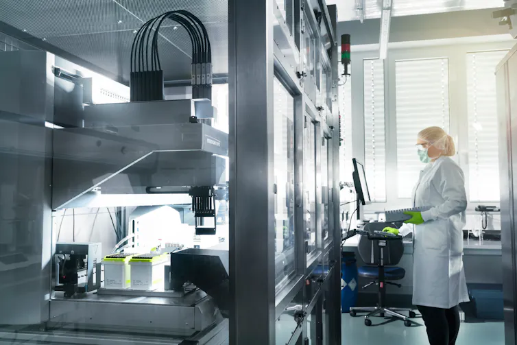 A technician working on the Pfizer/BioNTech vaccine at a BioNTech facility