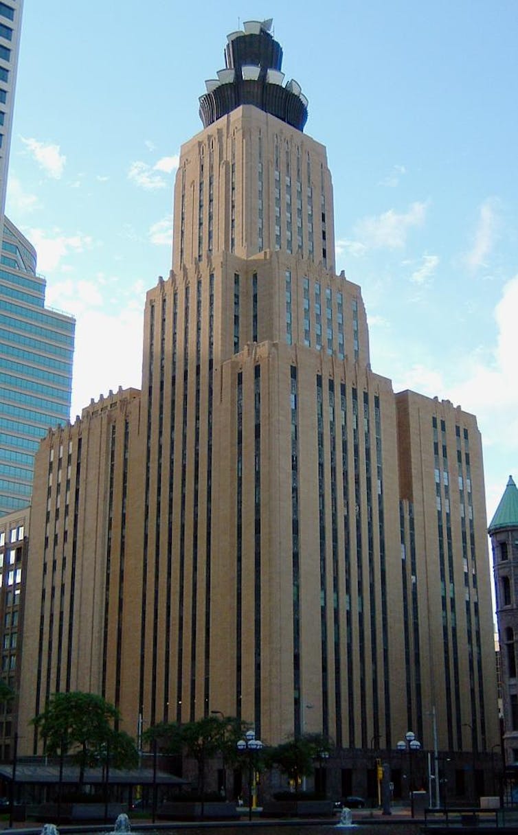 The CenturyLink Building in Minneapolis with a microwave antenna on the top. It looks like a black spiky crown on the top of the building.