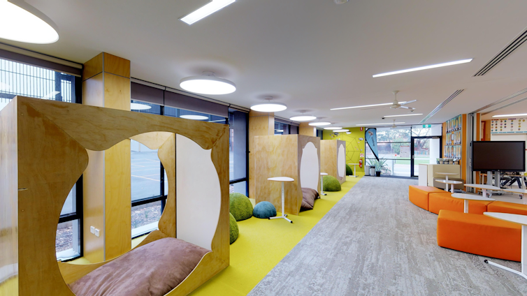 A classroom with flexible furniture and soft areas for independent learning.