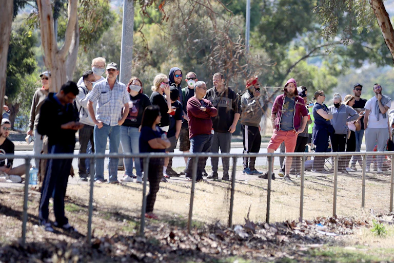 People queue for COVID testing at Parafield airport in Adelaide.