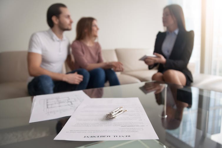 Tenants talking to agent