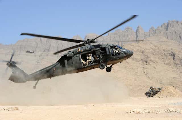A blackhawk, holding Australian troops, landing in Afghanistan