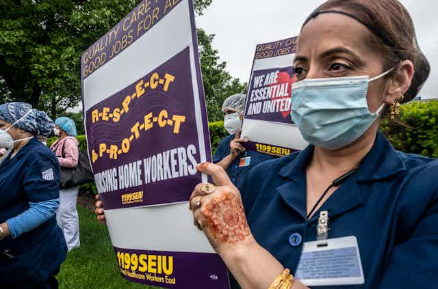 Nursing home workers protest working conditions in New Hyde Park, New York.