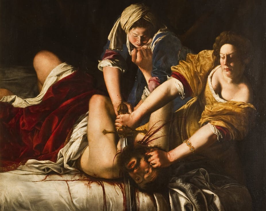 Judith beheads Holofernes while her accomplice pins him down.