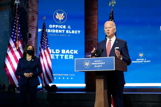 Joe Biden giving a speech behind a podium