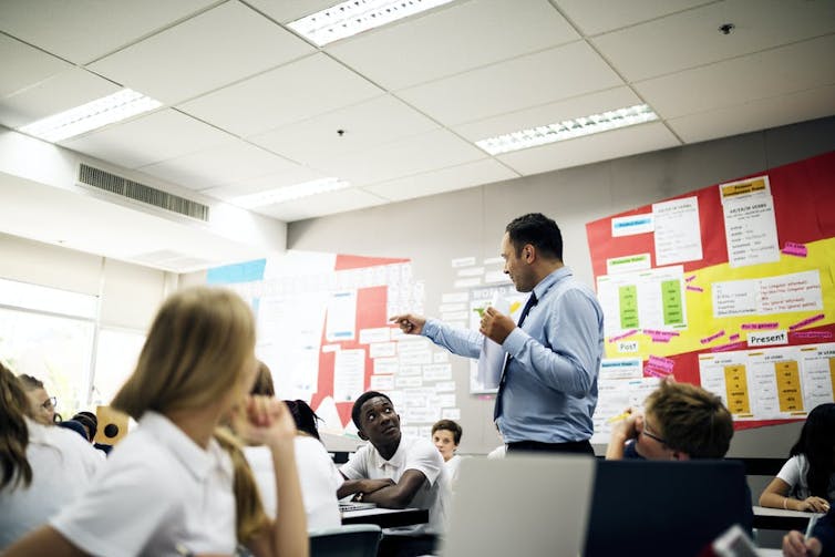 Man teaching to class