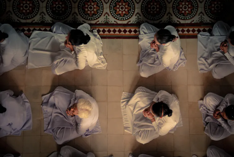 Aerial view of people in prayer.