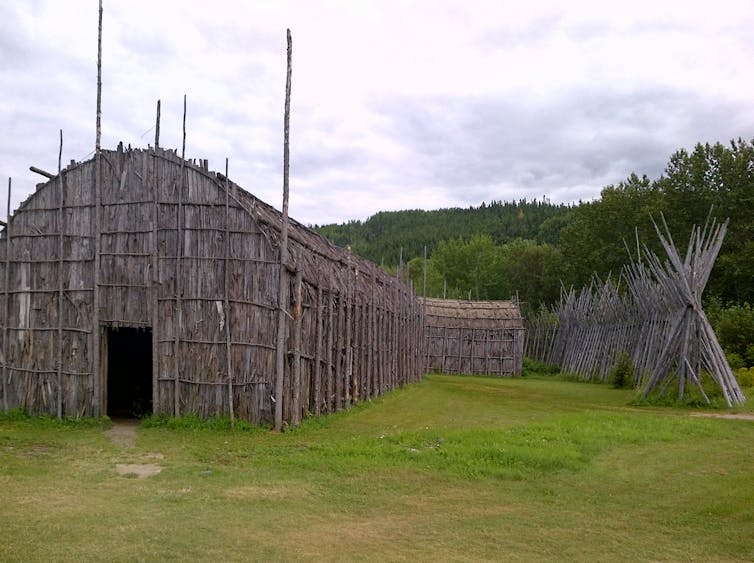 Image of an Iroquois longhouse, a building constructed from wood