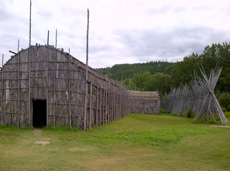 Image of an Iroquois longhouse, a building constructed from wood