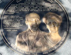 A medallion monument of a Black man and a white woman
