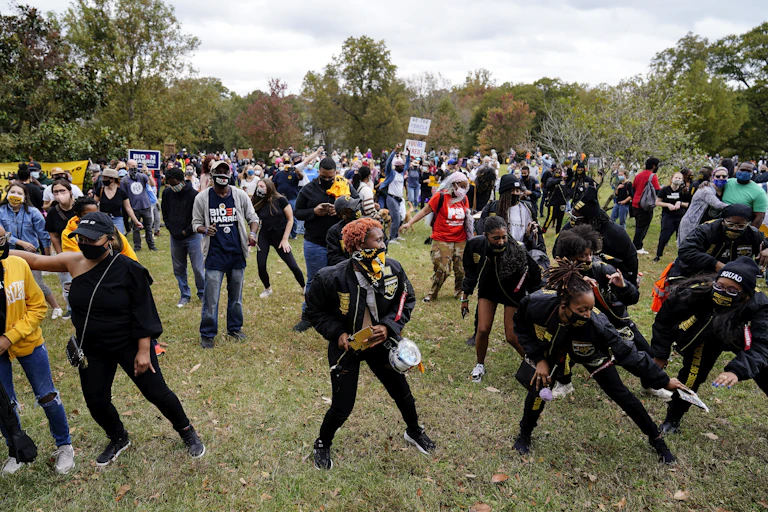 People dance and celebrate the election of Joe Biden as president