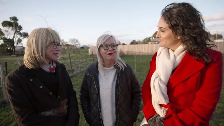 three women on a rural property