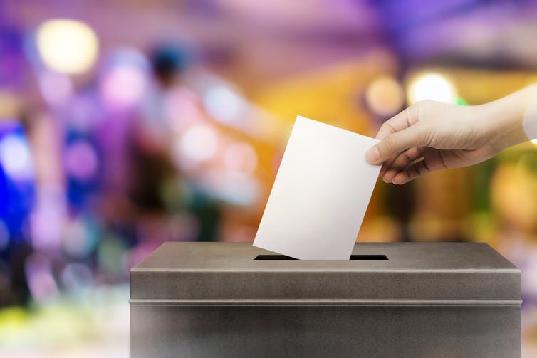 Person casting a vote.