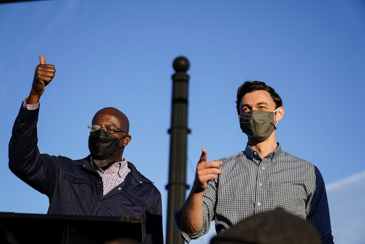Georgia Democratic Senate candidates Raphael Warnock and Jon Ossoff during a campaign rally