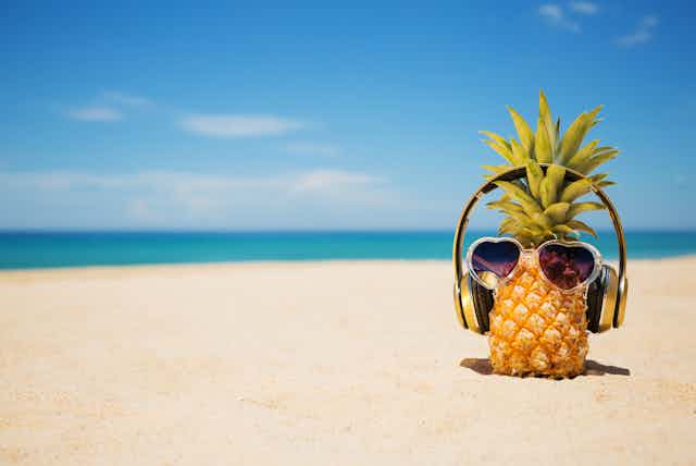 A pineapple wearing headphones