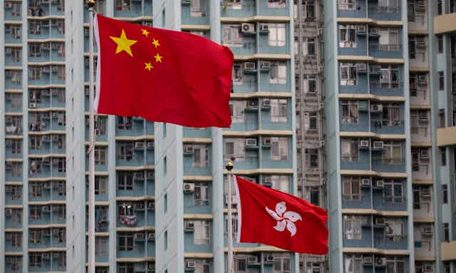 China's flag flies above Hong Kong's outside the West Kowloon Law Courts building in Hong Kong.