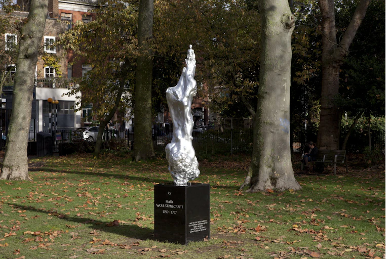 Silver statue in park.