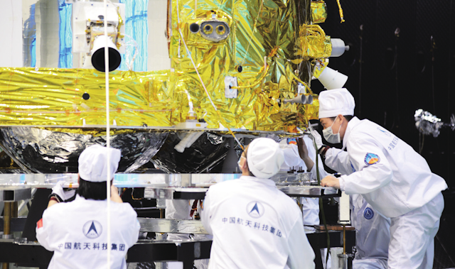 Image of the Chang’e 5 orbiter-return capsule being assembled.