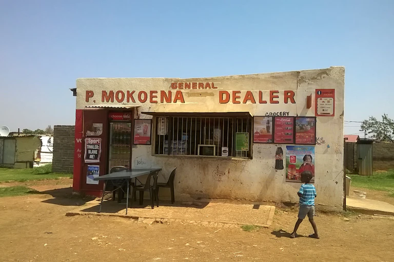 Informal shop and nearby shack in a low income settlement